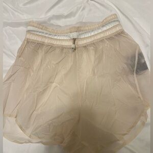 Lululemon opaque cream shorts w/ drawstring waist